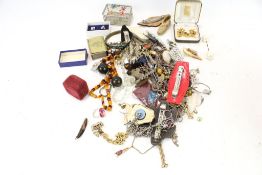 An assortment of costume jewellery. Including necklaces, pairs of earrings, headpieces, etc.