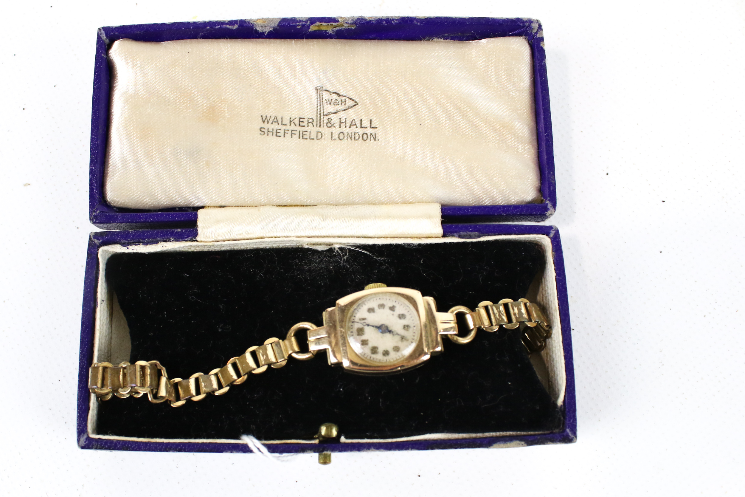 An early 20th century lady's 9ct gold tonneau cased wrist watch, circa 1926.