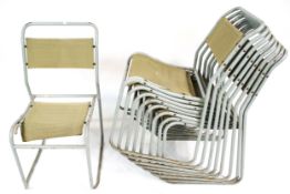 Nine mid-century industrial style tubular metal stacking canvas chairs, Pel Cox.