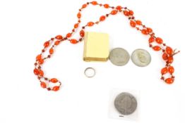 An assortment of jewellery, coins and collectables.