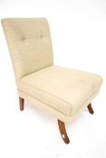 An cream upholstered button back bedroom chair.