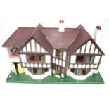 A vintage Tri-ang 'Stockbroker' mock-Tudor dolls house.