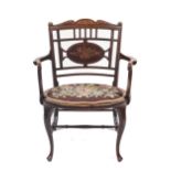 A late Victorian black walnut inlaid chair.