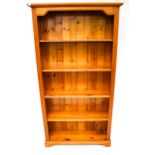 A contemporary pine free standing bookcase.