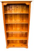 A contemporary pine free standing bookcase.