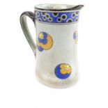 A Royal Doulton 'Titanian' jug decorated with patterned medallions on a grey ground.