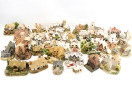 A collection of Lilliput Lane cottages. Including 'The Christmas Present', 'Frosty Morning', etc.