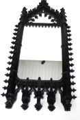 A large contemporary Gothic Revival rectangular wall mirror.