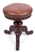 A 19th century Harrison & Harrison Birmingham mahogany three legged adjustable piano stool.