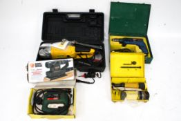 A group of assorted power tools. Including Bosch drill and jigsaw, Black & Decker sander, etc.