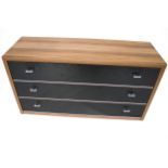 A contemporary chest of three long drawers.