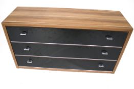 A contemporary chest of three long drawers.