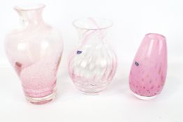 Three Caithness pink glass vases.