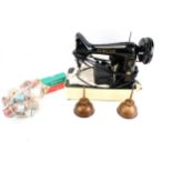 A Singer 99K electric sewing machine and accessories.