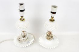 A pair of milk glass table lamps.