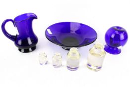 A selection of Bristol Blue glass and a set of glass weights.