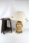An oak side table and a lamp.