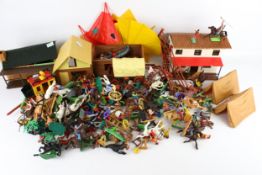 A collection of vintage 'Cowboys and American Indians' plastic toys.