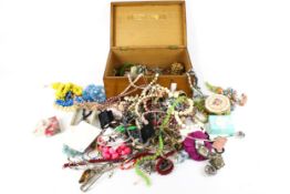 A collection of assorted costume jewellery. Including necklaces, pendants, brooches, etc.