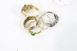 Five white and yellow metal rings.