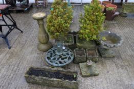 An assortment of stone garden planters.
