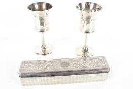 Two small silver goblets and a William IV silver mounted glass rectangular dressing table box.