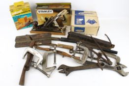 A collection of assorted vintage hand tools. Including chisels, pliers and a plane, etc.