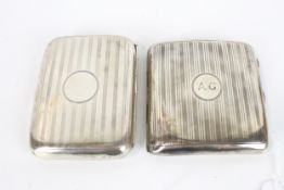 Two silver concave cigarette cases, each with engine turned bands.