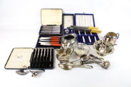 A collection of silver plate. Including five boxed sets of knives, spoons, etc.