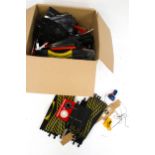 An assortment of Scalextric track and accessories. Including controllers, lapcounters, etc.