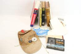 Train books and collectables. Including a hat with badges and postcards, etc.