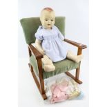 1950s Sarold doll and a small rocking chair.