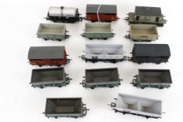 Fourteen OO gauge model railway wagons.