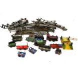 An assortment of O gauge model railway locomotive, rolling stock and track.