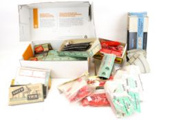 A collection of vintage Wrenn and Trix model accessories.