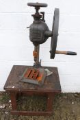 A early 20th century hand pillar drill No.15, made by Bradson and a bench.