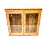 A vintage oak display cabinet.