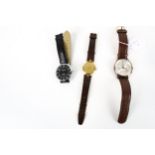 Three modern round wrist watches.