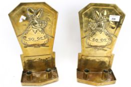 A pair of Arts & Crafts embossed brass wall sconces stamped 'J Co BRASS'.