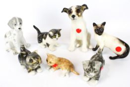 Seven ceramic kittens and puppies.