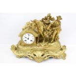 A vintage eight-day gilt cast metal mantel clock.