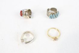 Five white and yellow metal rings. Including turquoise and carnelian.