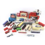 A collection of assorted diecast model buses and coaches.