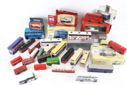 A collection of assorted diecast model buses and coaches.