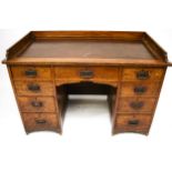 A late Victorian/early Edwardian twin pedestal oak desk. With an inset top and gallery rail.