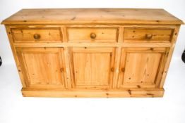 A contemporary pine sideboard.