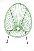A sage green ovoid Salsa style child's outdoor four-legged chair.