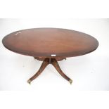 A 20th century mahogany coffee table.