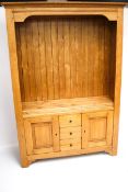 A 20th century stained pine cupboard.