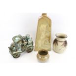 A Collection of four assorted studio pottery items. Including a 'Rag & Bone' lorry, etc. Max.